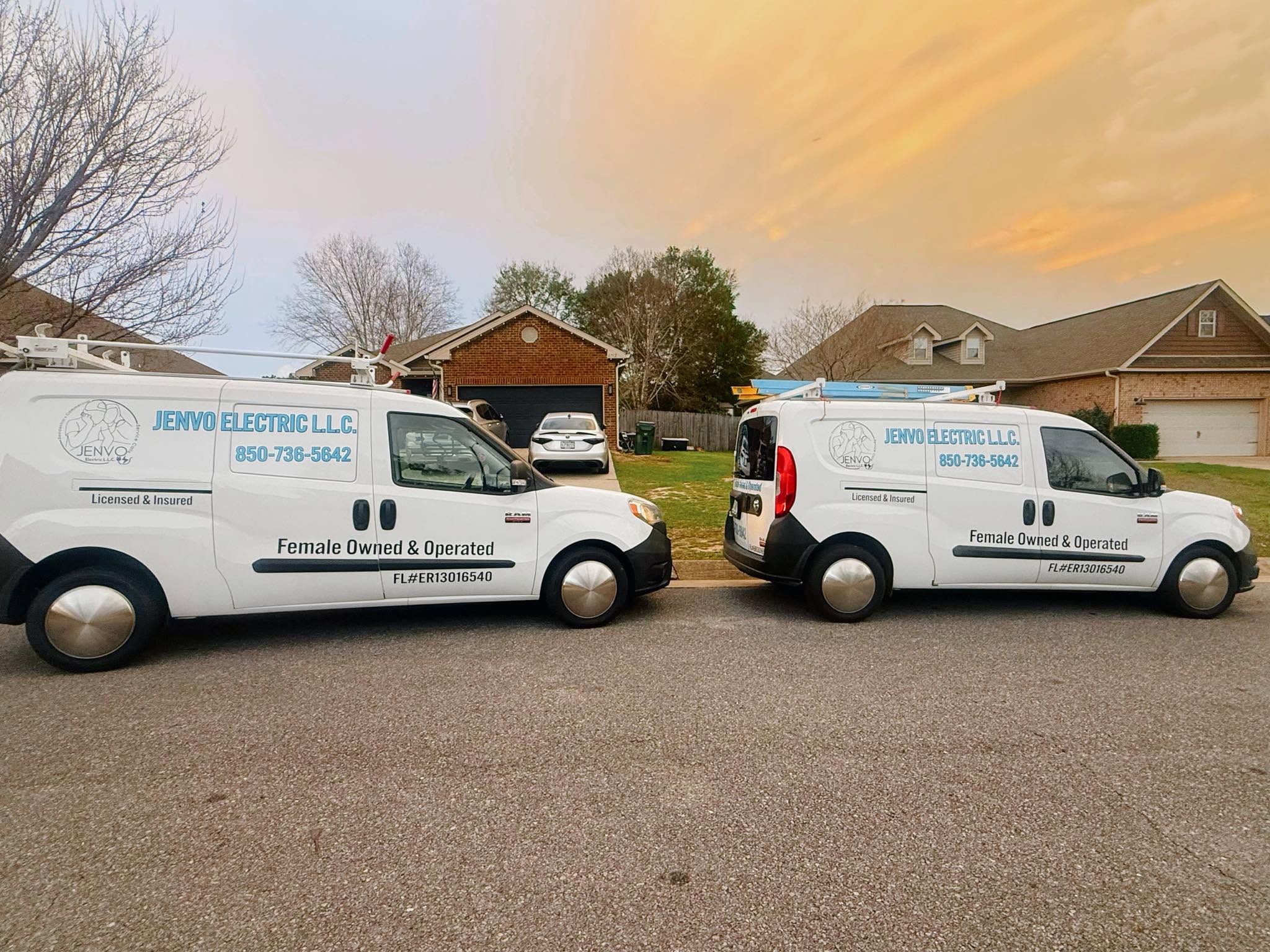 JENVO Electric L.L.C. work vans parked in a Milton, FL neighborhood